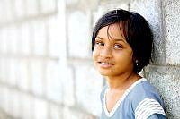 Young girl in front of wall.jpg