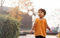 Young boy orange shirt.jpg